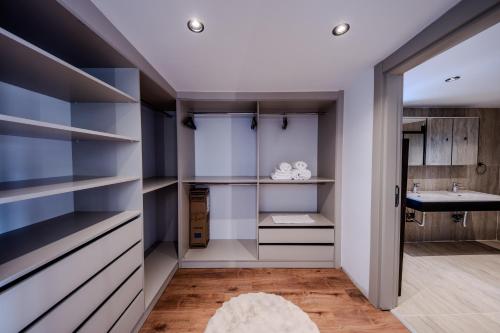 a bathroom with blue cabinets and a sink at Luxury Forest Villas with Private Pool in Antalya