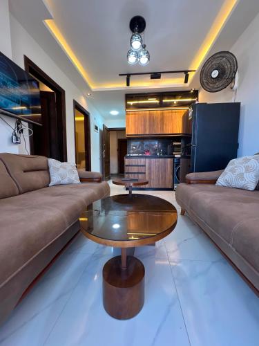 a living room with a couch and a coffee table at عماره 227 in El Alamein