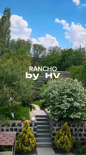 a sign for the rhapsody in at Rancho on Sevan beach by HV in Sevan