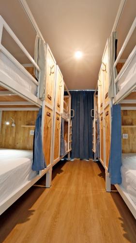 a group of bunk beds in a room at Wonderful Bangkok in Bangkok