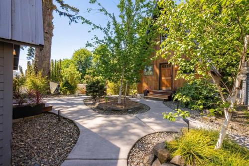 a home with a garden with trees and a walkway at Artbliss Hotel in Stevenson