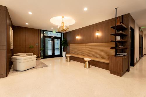 a large bathroom with a toilet and a chandelier at Kins Hotel in Los Angeles