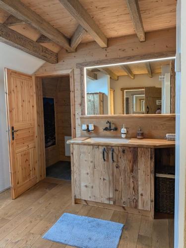 a bathroom with a sink and a mirror at Gästehaus LeLo 7 in Solingen