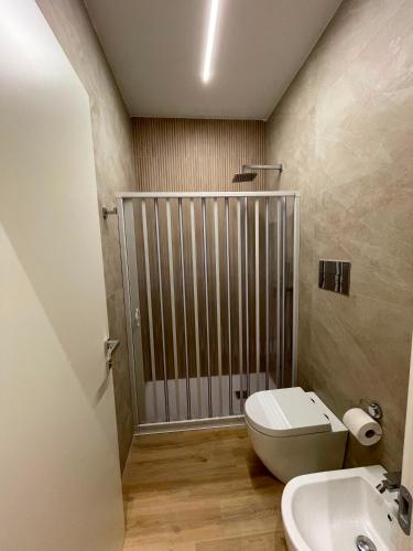 a bathroom with a toilet and a sink at Solea Home in Termoli