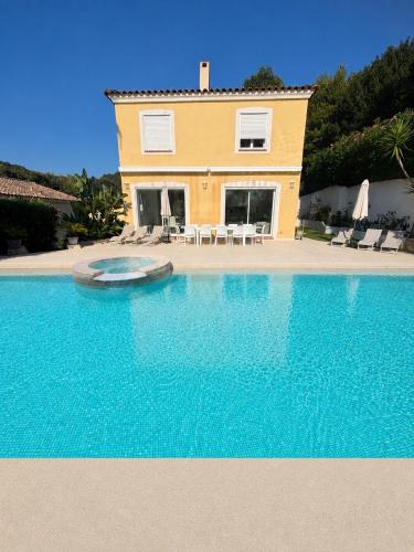a house with a swimming pool in front of a house at Cannes centre Villa piscine spa in Cannes