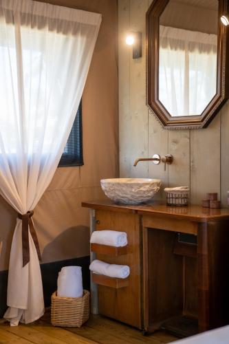 a bathroom with a sink and a mirror at Glamping Tenuta Ca'Nova in Mestrino
