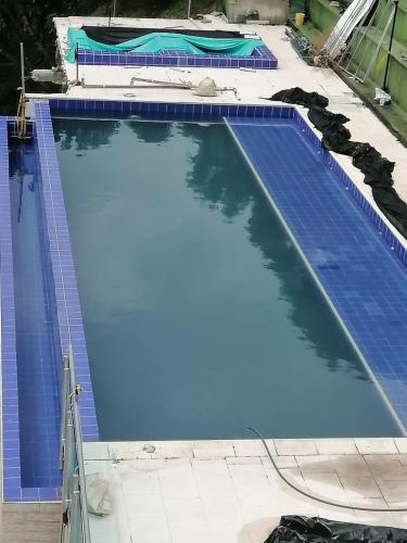 an overhead view of a large blue swimming pool at Modern apartment with pool-La Mesa in La Mesa
