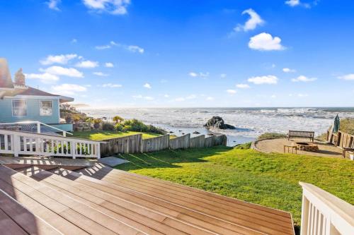 a house with a deck looking out at the ocean at Coastal Coziness in Cayucos