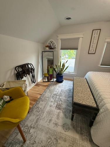 a living room with a couch and a chair at Gorgeous Home in Prime Location in Sauk City
