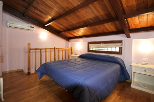 Säng eller sängar i ett rum på La Chioccia