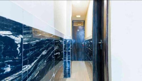 a glass door in a hallway with a hallwayexit at Hotel shree in Indore