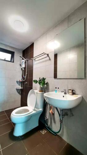 a bathroom with a toilet and a sink at 38 Romantic Studio Meritus Prai in Perai