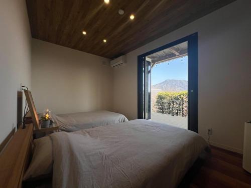 Llit o llits en una habitació de 一棟貸しVillaEDGE