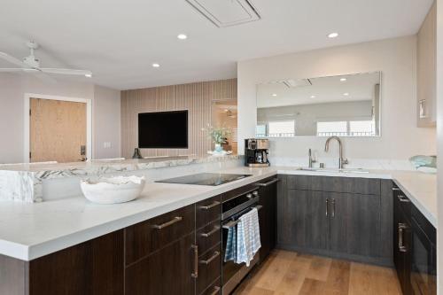 a large kitchen with a sink and a counter at Carpinteria Shores CS 105 in Carpinteria