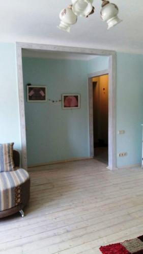 an empty living room with a couch in a room at Eco-Apartment in Province Style in Myrhorod