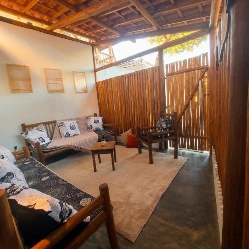 a living room with a couch and a table at Residência Thomas in Itacaré