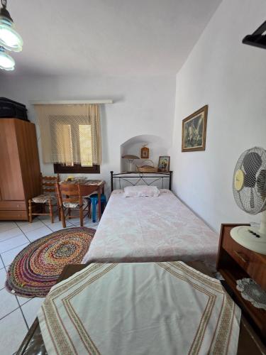 a bedroom with a large bed in a room at Sidirounta Traditional Home 2 in Chios