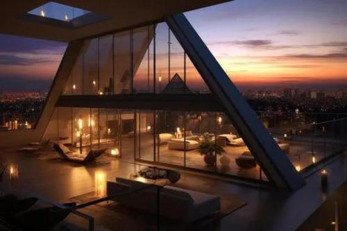 a building with a view of a city at night at Manchester castle in Nagpur