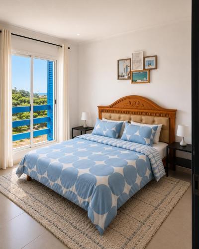 a bedroom with a large bed and a large window at Panoramic View, Cozy apartment M'diq in M'diq
