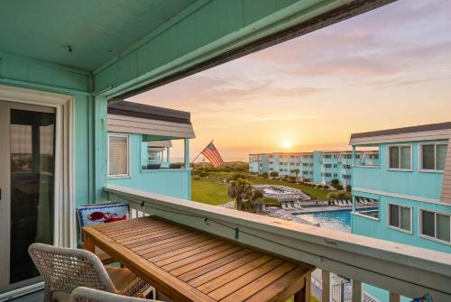 a balcony with a view of a pool and a building at Beach Getaway w Pool & Private Balcony in Atlantic Beach