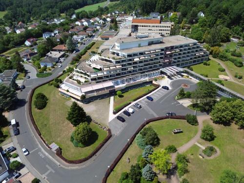 an aerial view of a large building with a parking lot at Parkwohnstift Bad Kissingen in Bad Kissingen