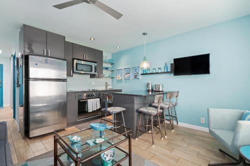 a kitchen with a stainless steel refrigerator and a counter at Sunset Shores Sunset Shores 246 in Carpinteria