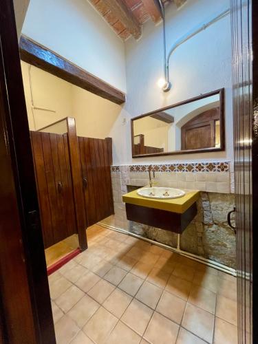 a bathroom with a sink and a mirror at Atelier Oaxaca in Oaxaca City