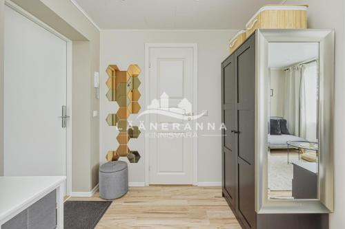 a living room with a sliding glass door to a bedroom at Sweet apartament in Haapsalu