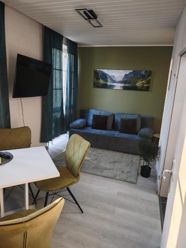 a living room with a couch and a table at Monica Inn in Passau