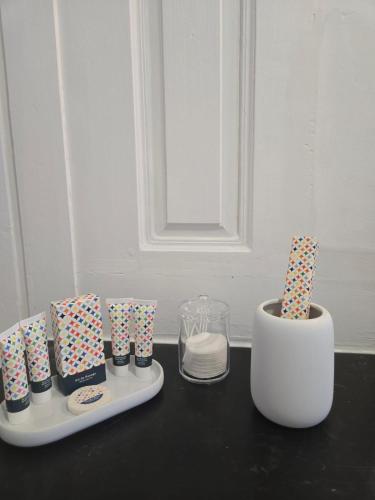 a table with some presents and a vase on it at L'argonnière in Buzancy