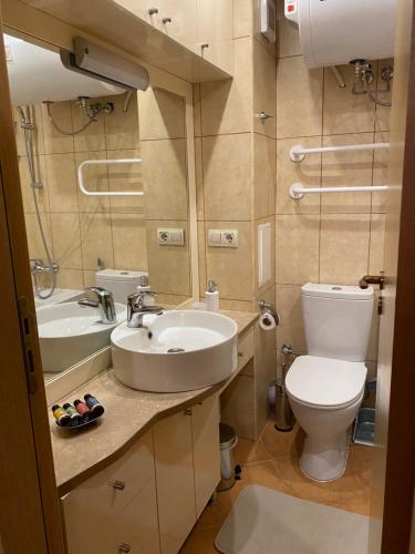 a bathroom with a sink and a toilet at Bellevue Beachfront Paradise in Ravda