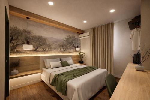 a bedroom with a bed and a painting on the wall at Hospedium GL Hotel Andújar in Andújar