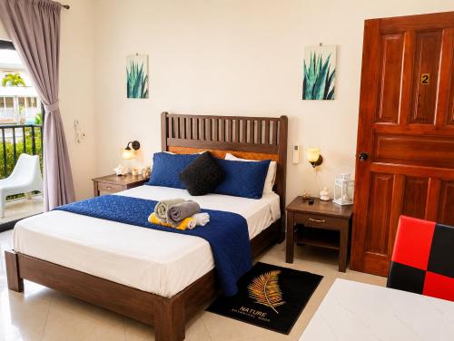 a bedroom with a bed with a stuffed animal on it at Best View 2 Adults Only in La Laguna