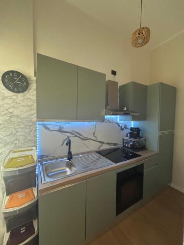 a kitchen with a sink and a counter top at Maris Home in Luino
