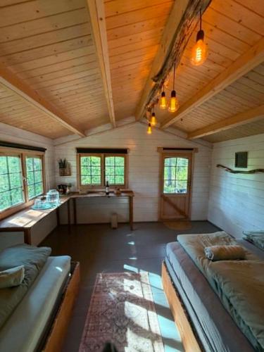a room with a bed and a desk in a house at opplevelses hytta badestamp ridning osv in Skien