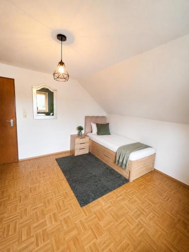 a bedroom with a bed in a room at Jagdhaus am Neubäuer See in Roding