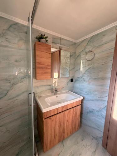 a bathroom with a sink and a shower at Terra Kampos Chios in Chios