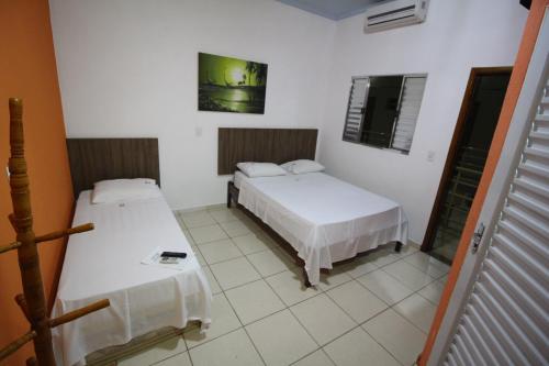 Katil atau katil-katil dalam bilik di Pousada Do Mineiro