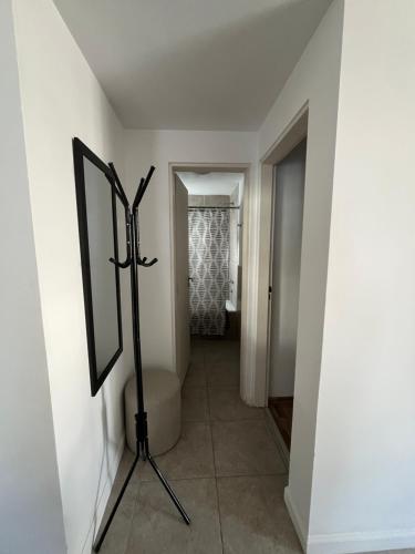 a mirror on a stand in a hallway with a bathroom at MyN 2 in La Plata