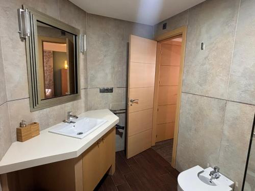 a bathroom with two sinks and a shower at Plaza España - Nerja centro in Nerja