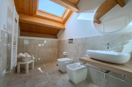 a bathroom with a sink and a toilet at The White House in Miglianico