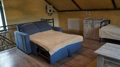 a bedroom with a bed in a room with a table at Jermuk garden in Kechʼut