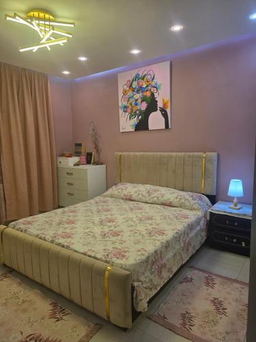 a bedroom with a bed and a dresser at Ayem house in Souidania