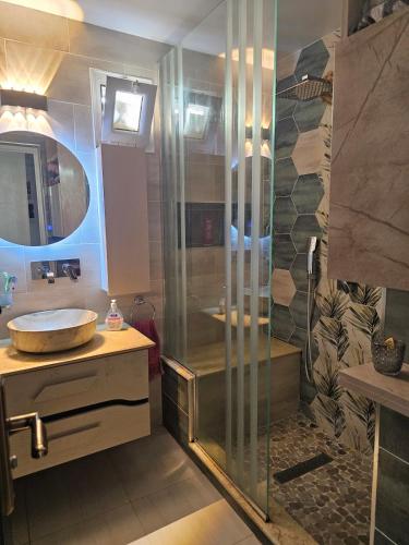 a bathroom with a shower and a sink at Ayem house in Souidania