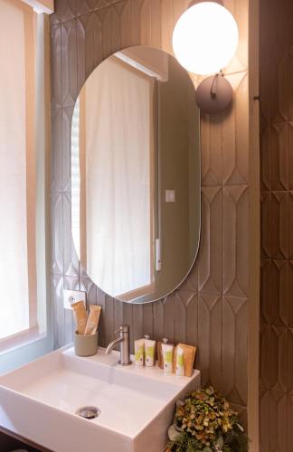 a bathroom with a sink and a mirror at Dimora Nòva Verona in Verona