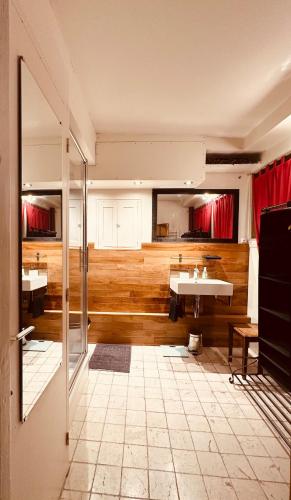 a bathroom with two sinks and a mirror at Historic Centre Studio, St-André & Bastille view! in Grenoble