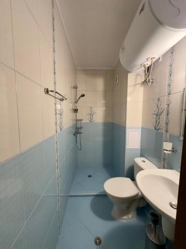 a bathroom with a toilet and a sink at AM Sea Studios in Ravda