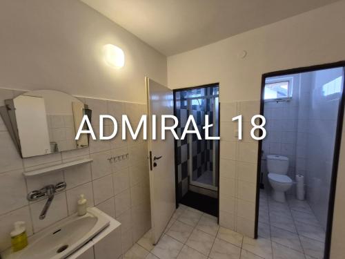 a bathroom with a shower and a sink and a toilet at Bursztyn in Władysławowo