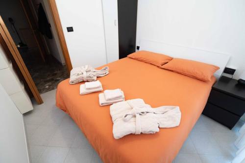 a bedroom with a bed with towels on it at Brighella in Putignano