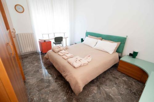a bedroom with a bed with towels on it at Brighella in Putignano